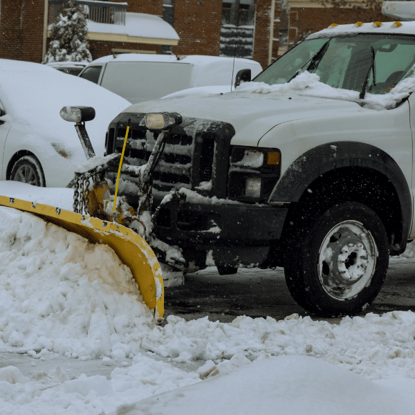 Fleet of snow plow trucks and loaders ready for commercial snow removal service