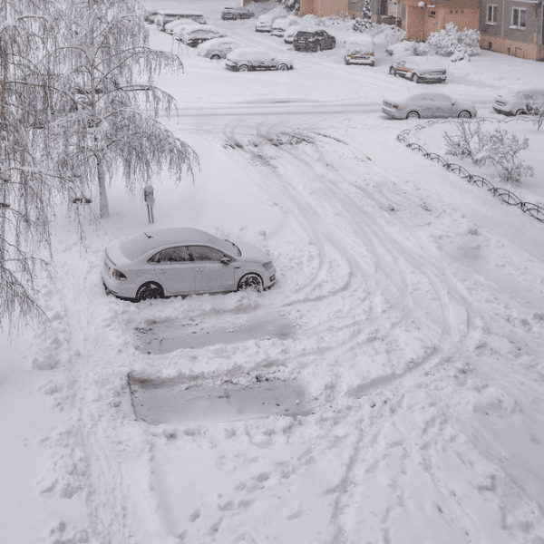 Snow-covered loading dock and icy surface at an industrial warehouse